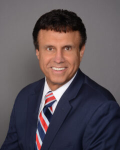 headshot of Edward P. Shamy in a suit